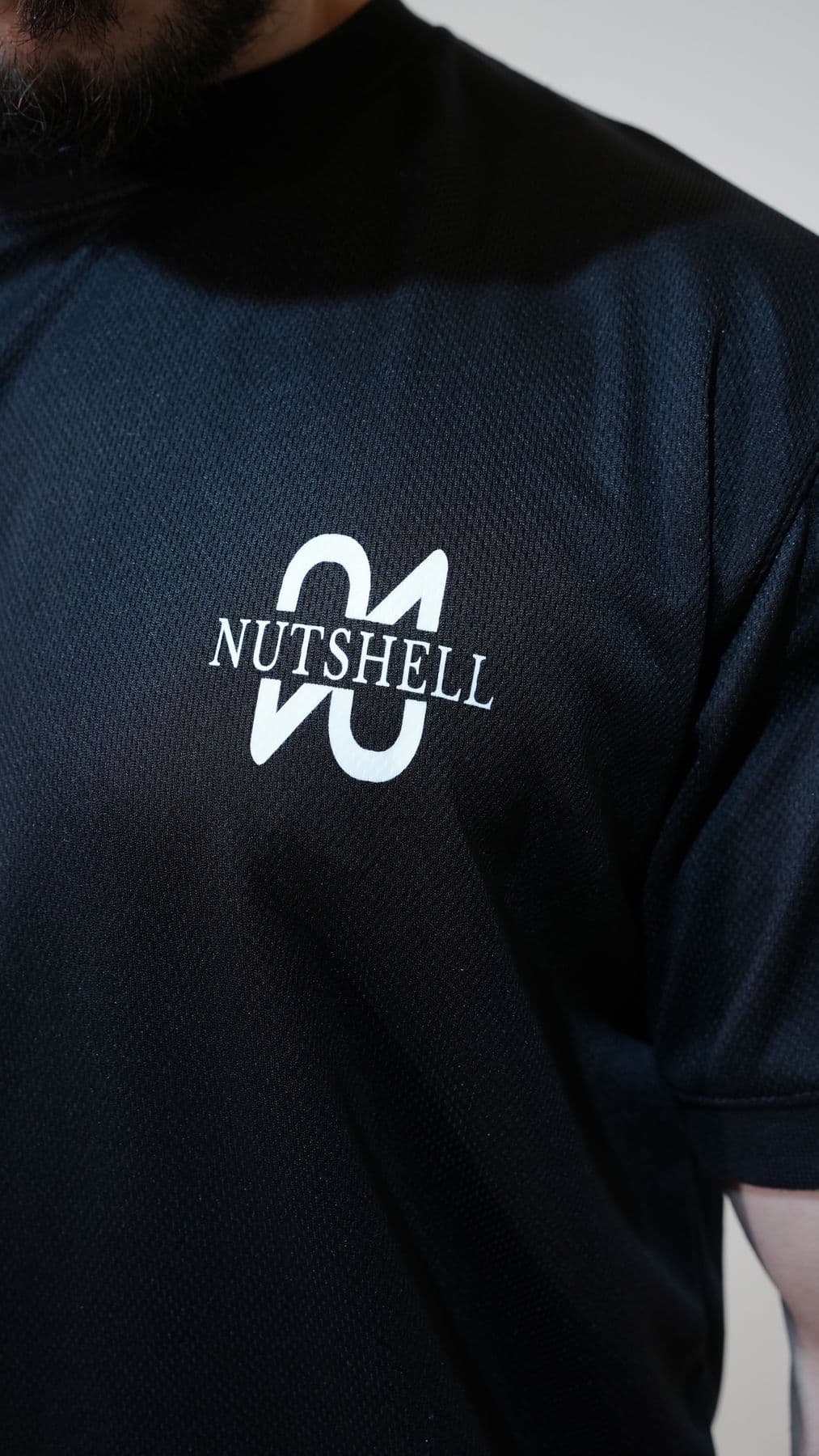 Logo detail on black tee